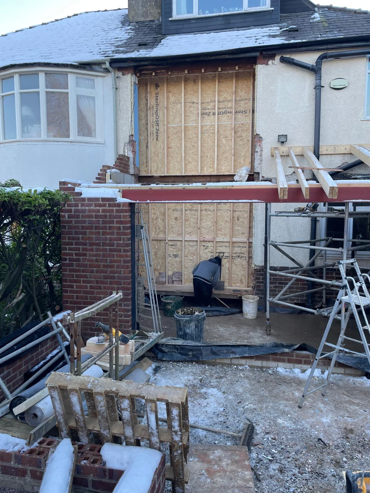 Rear house extension during construction with scaffolding