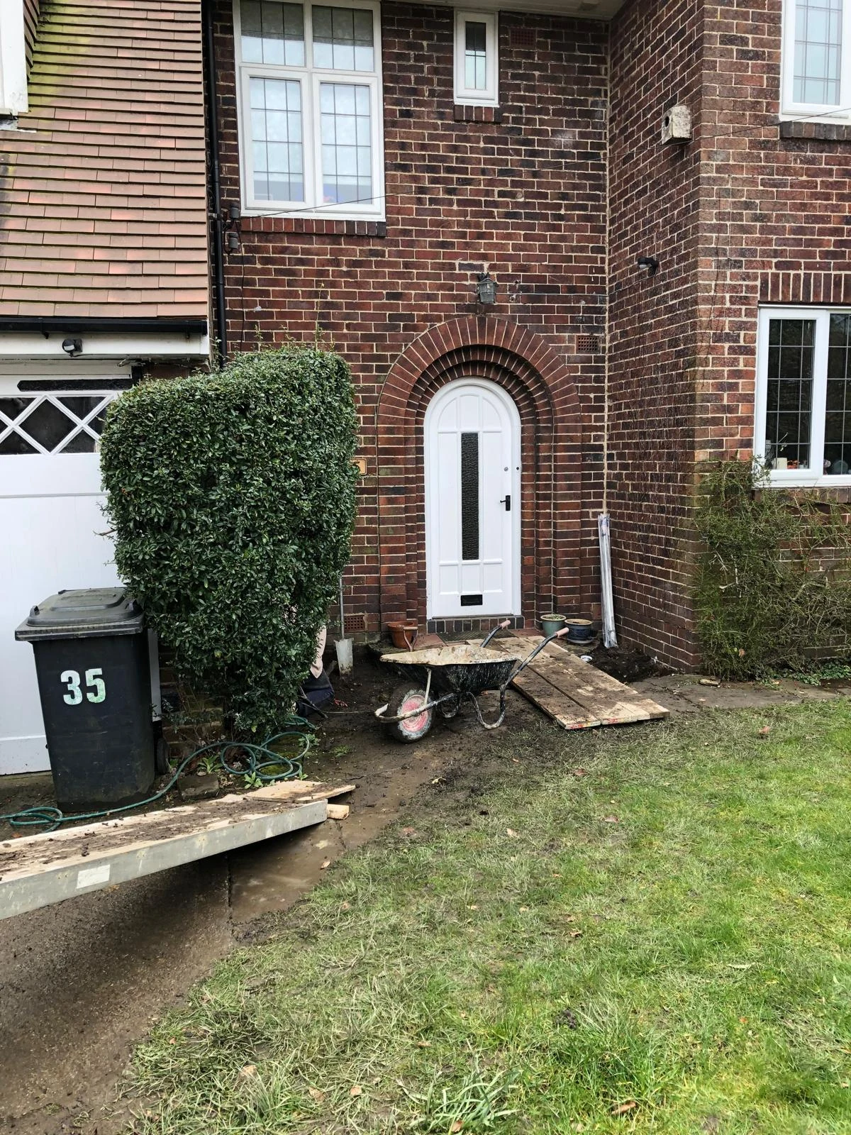 Original brick house entrance before a porch extension