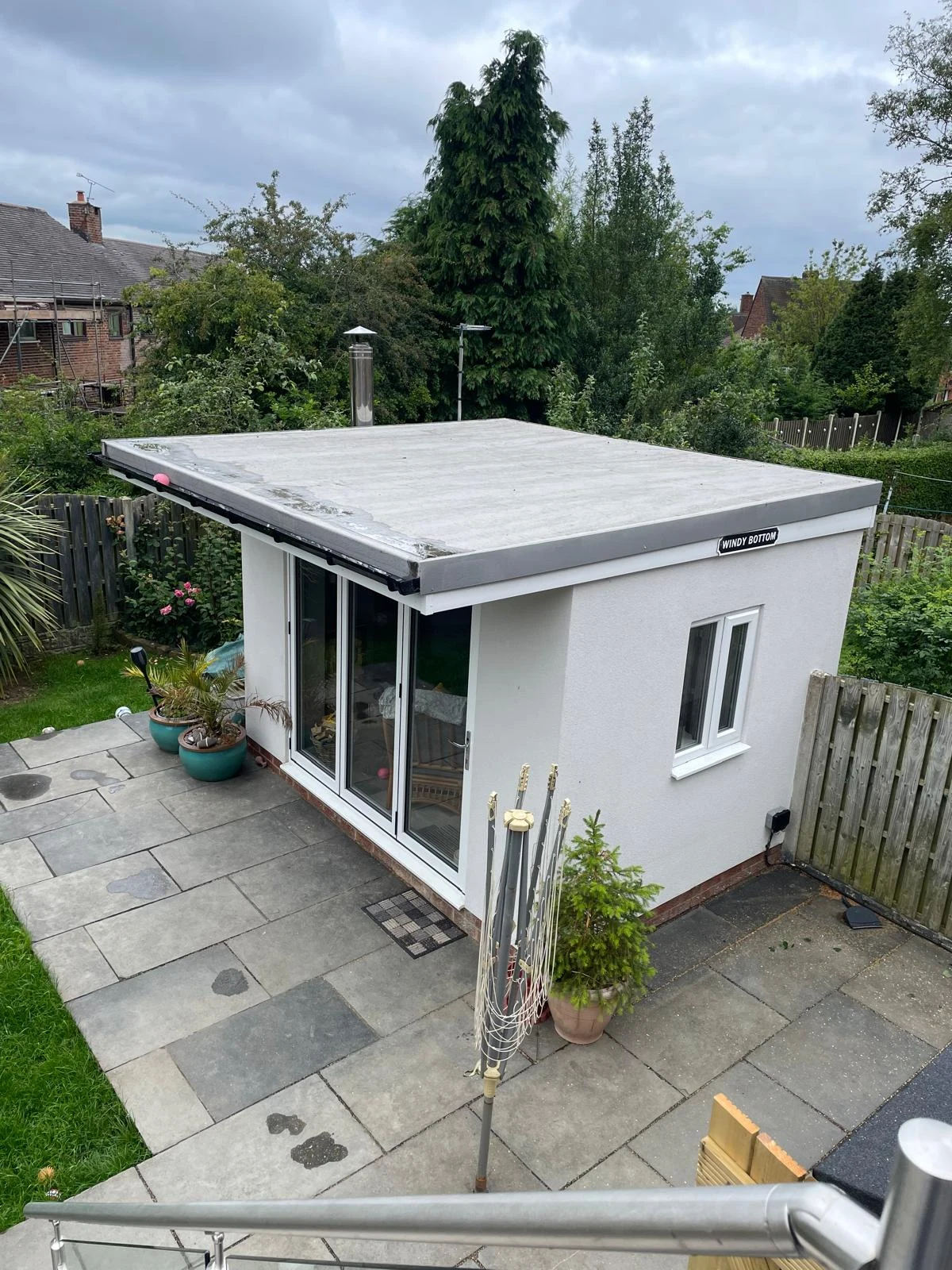 Completed white rendered garden room with glazed doors